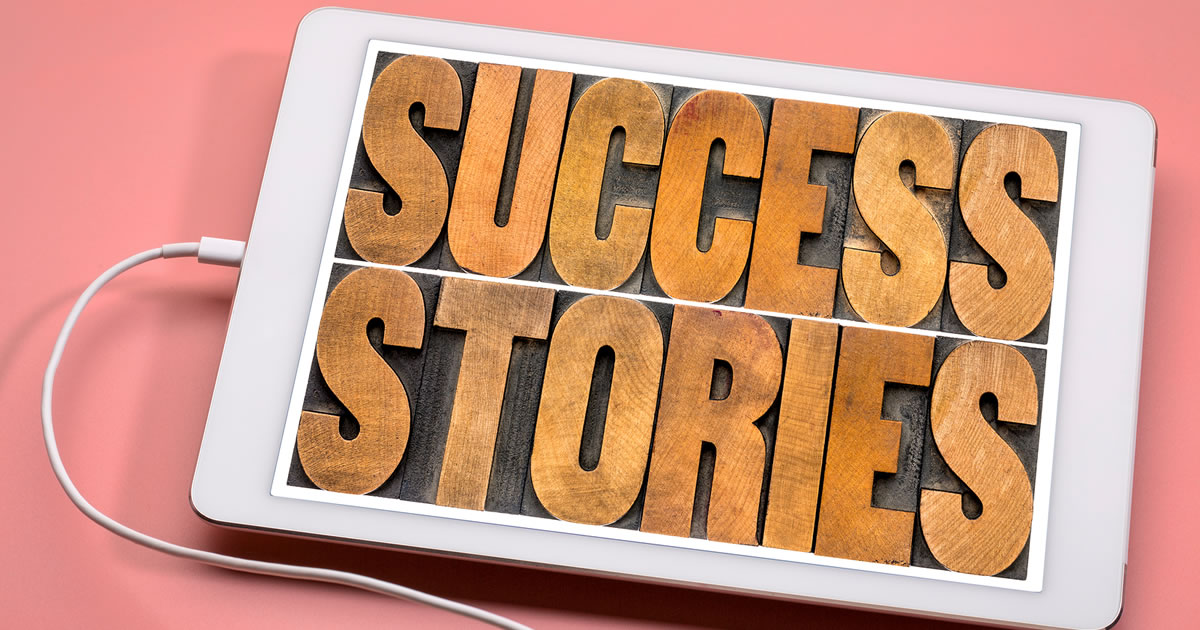 Success stories typography &mdash; word abstract in vintage letterpress wood type on a digital tablet